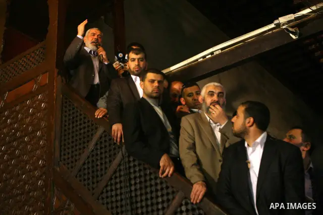 Palestinian prime minister in Gaza Strip, Ismail Haniya (top L) delivers a speech after Friday prayers in the Al-Azhar grand mosque in Cairo on February 24, 2012 where he hailed the "heroic" Syrian struggle for democracy...