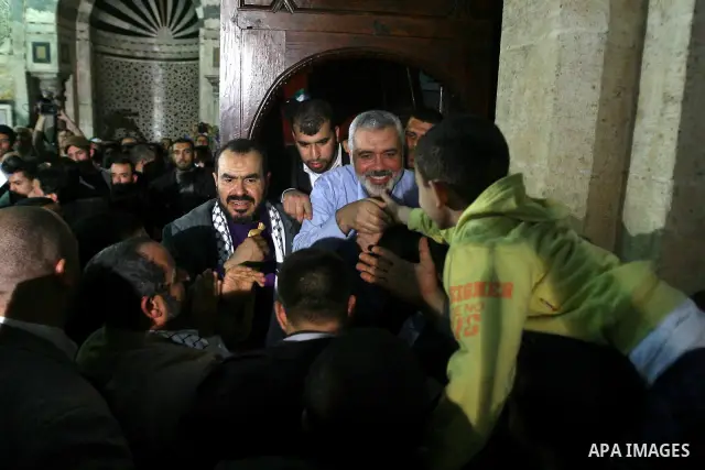 Palestinian prime minister in Gaza Strip, Ismail Haniya greets supporters as he leaves following Friday noon prayer at Al-Azhar mosque, in Cairo, Egypt, 24 February 2012. According to media reports, Haniyeh joined hundre...