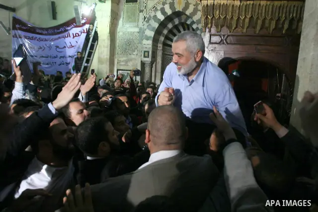Palestinian prime minister in Gaza Strip, Ismail Haniya greets supporters as he leaves following Friday noon prayer at Al-Azhar mosque, in Cairo, Egypt, 24 February 2012. According to media reports, Haniyeh joined hundre...