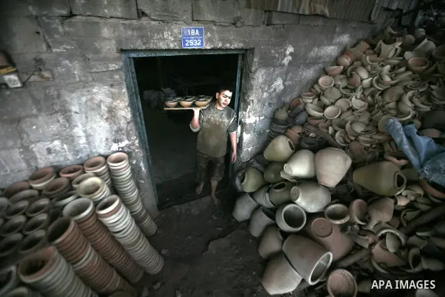 Palestinian Sabri Atallah, stores pots built with natural clay at his grandfather's shop 'Atallah Pottery', in Gaza Strip on 24 February 2012. Atallah pottery shop is one of the biggest pottery shops in Gaza strip. Child...