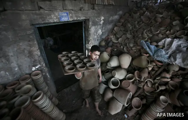 Palestinian Sabri Atallah, stores pots built with natural clay at his grandfather's shop 'Atallah Pottery', in Gaza Strip on 24 February 2012. Atallah pottery shop is one of the biggest pottery shops in Gaza strip. Child...