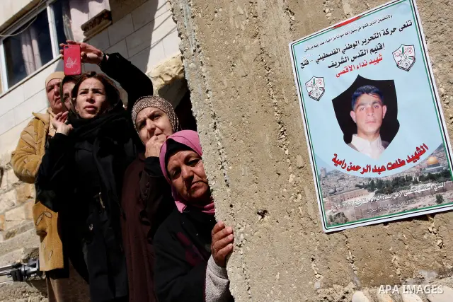Palestinian women mourn the death of Talaat Rameya during his funeral procession in the town of Al-Ram on the outskirts of Jerusalem on February 25, 2012. Rameya was killed in one of a string of clashes on February 24 be...