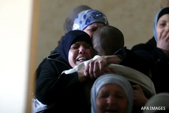 Palestinian women mourn the death of Talaat Rameya during his funeral procession in the town of Al-Ram on the outskirts of Jerusalem on February 25, 2012. Rameya was killed in one of a string of clashes on February 24 be...