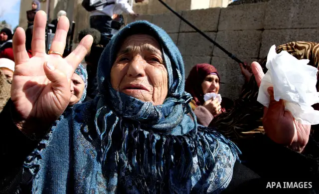 Palestinian women mourn the death of Talaat Rameya during his funeral procession in the town of Al-Ram on the outskirts of Jerusalem on February 25, 2012. Rameya was killed in one of a string of clashes on February 24 be...