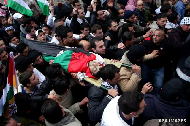 Palestinians carry the body of 23-year-old Talat Ramia during his funeral in the West Bank town of Al-Ram, near Jerusalem February 25, 2012. Ramia, a Palestinian protester who participated in clashes against Israeli sold...