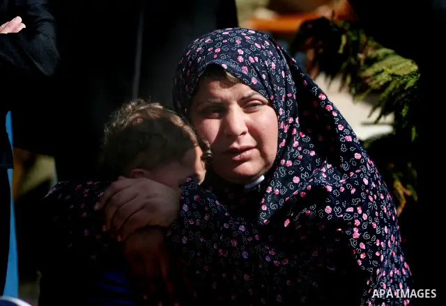 Palestinian women mourn the death of Talaat Rameya during his funeral procession in the town of Al-Ram on the outskirts of Jerusalem on February 25, 2012. Rameya was killed in one of a string of clashes on February 24 be...