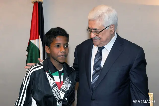 Palestinian President, Mahmoud Abbas (Abu Mazen), during a meeting with Palestine Mission junior team, participating in the annual Asian Festival of the football players under the age of 14 years, in qatar, on Feb 25, 20...