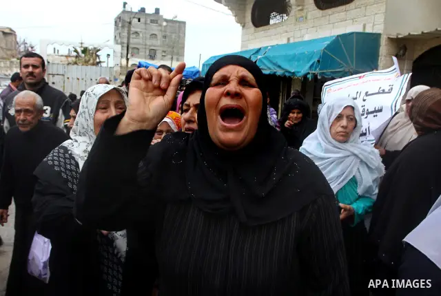Palestinians take part in a protest in front of the UNRWA headquarters, against reducing the services provided to Palestine refugees in Gaza city, on Feb. 26, 2012. Photo by Ashraf Amra