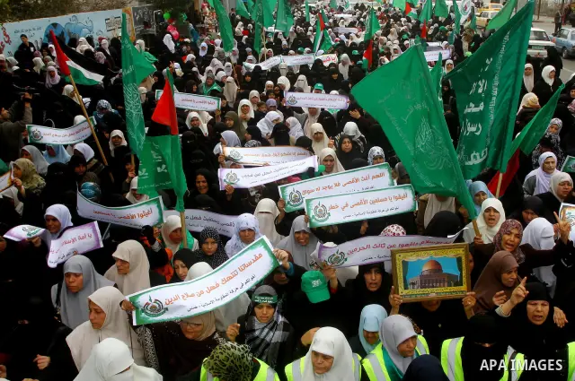 Palestinian women gather as they protest in Gaza City on February 26, 2012, two days following violence in the flashpoint Al-Aqsa mosque compound in Jerusalem's Old City, between Israeli forces and Palestinians. The unre...