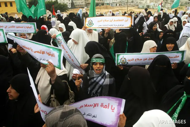 Palestinian women gather as they protest in Gaza City on February 26, 2012, two days following violence in the flashpoint Al-Aqsa mosque compound in Jerusalem's Old City, between Israeli forces and Palestinians. The unre...