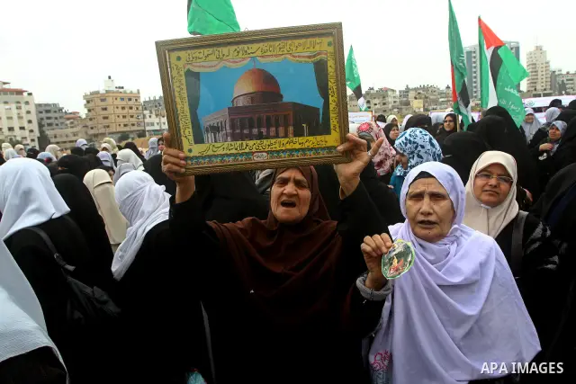 Palestinian women gather as they protest in Gaza City on February 26, 2012, two days following violence in the flashpoint Al-Aqsa mosque compound in Jerusalem's Old City, between Israeli forces and Palestinians. The unre...
