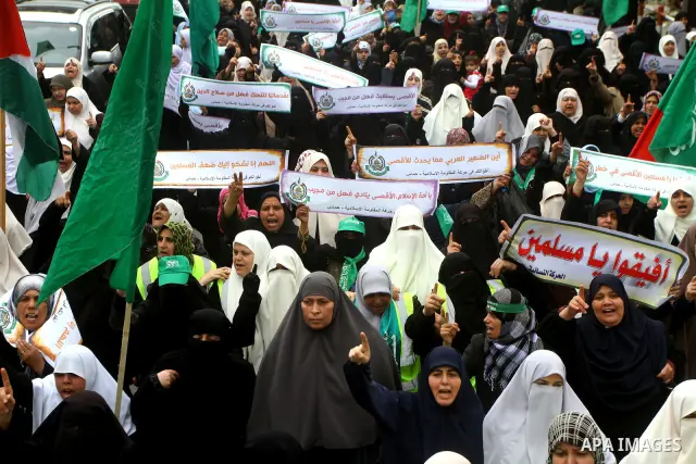 Palestinian women gather as they protest in Gaza City on February 26, 2012, two days following violence in the flashpoint Al-Aqsa mosque compound in Jerusalem's Old City, between Israeli forces and Palestinians. The unre...