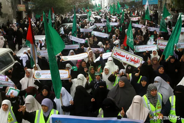 Palestinian women gather as they protest in Gaza City on February 26, 2012, two days following violence in the flashpoint Al-Aqsa mosque compound in Jerusalem's Old City, between Israeli forces and Palestinians. The unre...