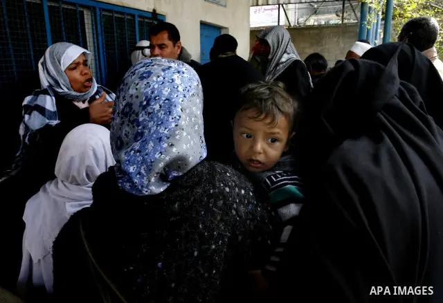 Palestinians receive their monthly food aid at a UN distribution center in the Rafah refugee camp, southern Gaza Strip on February 26, 2012. Photo by Abed Rahim Khatib