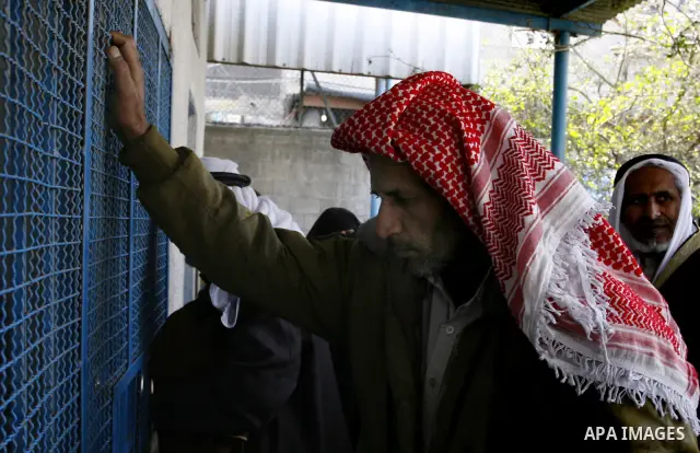 Palestinians receive their monthly food aid at a UN distribution center in the Rafah refugee camp, southern Gaza Strip on February 26, 2012. Photo by Abed Rahim Khatib