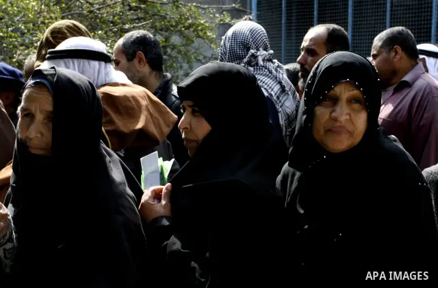 Palestinians receive their monthly food aid at a UN distribution center in the Rafah refugee camp, southern Gaza Strip on February 26, 2012. Photo by Abed Rahim Khatib