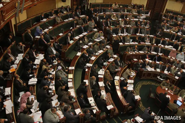 Egypt's army-appointed Prime Minister Kamal al-Ganzouri speaks during a parliament session in Cairo February 26, 2012. Egypt's military rulers invited the parliament's two houses to convene on Saturday to elect an assemb...