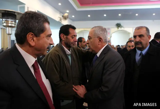 Palestinian Prime Minister, Salam Fayyad, attends funeral of Talat Ramia in the West Bank town of Al-Ram, near Jerusalem, on Feb. 26, 2012. Photo by Mustafa Abu Dayeh