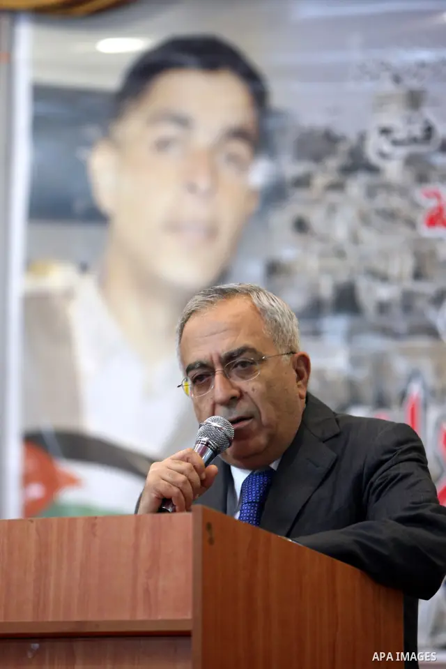 Palestinian Prime Minister, Salam Fayyad, delivers speech during funeral of Talat Ramia in the West Bank town of Al-Ram, near Jerusalem, on Feb. 26, 2012. Photo by Mustafa Abu Dayeh