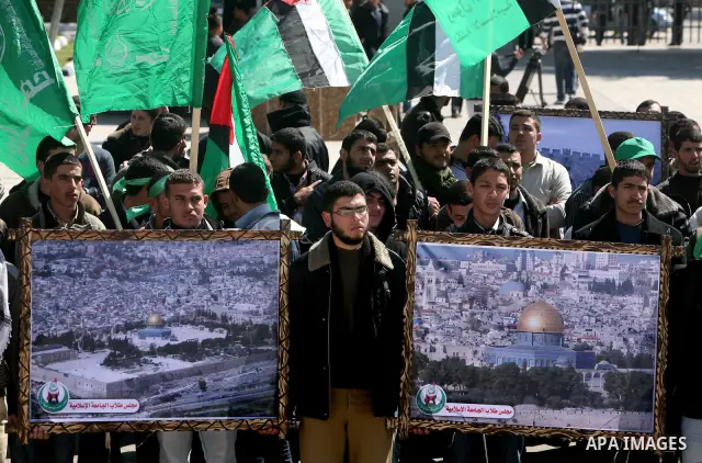 Palestinian students gather as they protest in Gaza City on February 27, 2012, two days following violence in the flashpoint Al-Aqsa mosque compound in Jerusalem's Old City, between Israeli forces and Palestinians. The u...