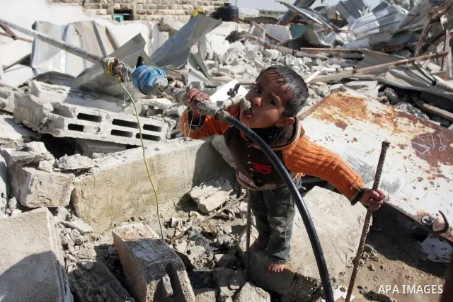 Palestinian Children inspects their hous which was demolished by Israeli army that was built without a construction permit, in bedouin area, village of Jaba, north of Jerusalem on Feb. 27, 2012. Photo by Issam Rimawi