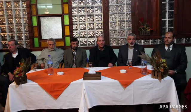 Palestinian Prime Minister in Gaza Strip, Ismail Haniyeh, receives Official Popular Front in the outside Maher al-Taher, in Gaza City on Feb. 27, 2012. Photo by Mohammed Ostaz