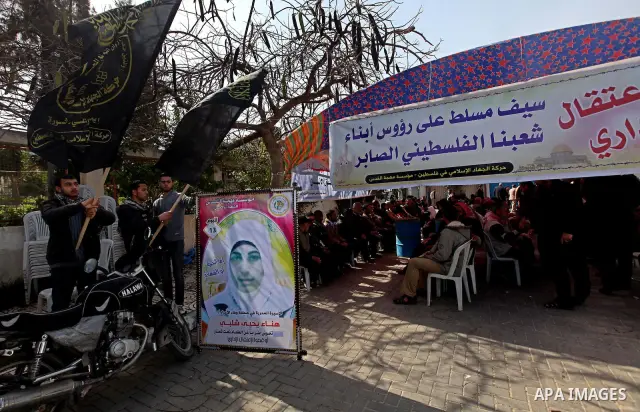 A picture of Palestinian prisoner Hana'a Shalabi stands outside a protest tent outside the United Nations building in Gaza City on February 28, 2012. Shalabi, released by Israel in a prisoner swap last year but re-arrest...