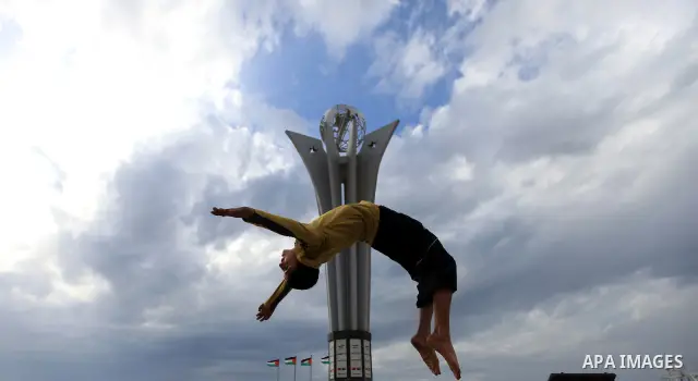 A Palestinian boy enjoys practicing jump on the beach in Gaza City, on Feb. 28, 2012. Photo by Wisam Nassar