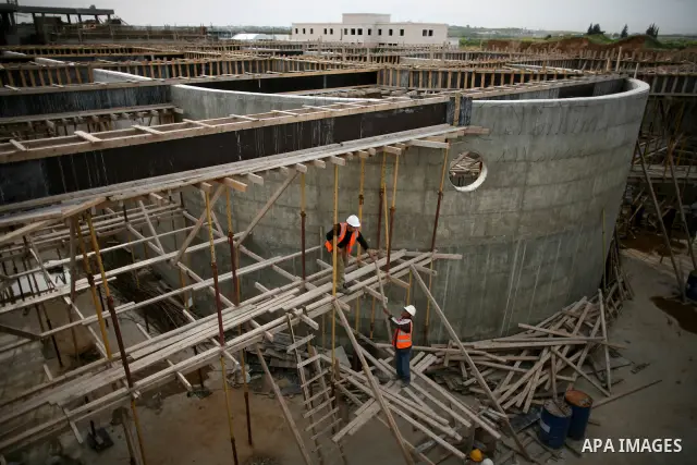 Palestinian workers work in building a sewage desalination station in the Northern Gaza Strip on Feb. 26, 2012. The Sewage desalination project is funded by the International Bank and EU with budget 40 million dollar. Th...