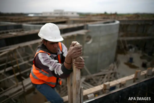 Palestinian workers work in building a sewage desalination station in the Northern Gaza Strip on Feb. 26, 2012. The Sewage desalination project is funded by the International Bank and EU with budget 40 million dollar. Th...