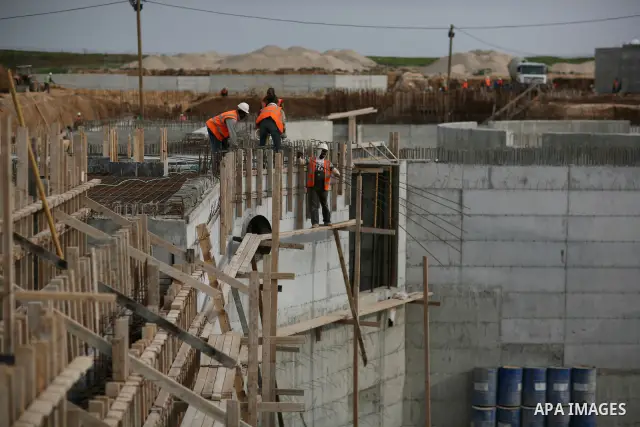 Palestinian workers work in building a sewage desalination station in the Northern Gaza Strip on Feb. 26, 2012. The Sewage desalination project is funded by the International Bank and EU with budget 40 million dollar. Th...