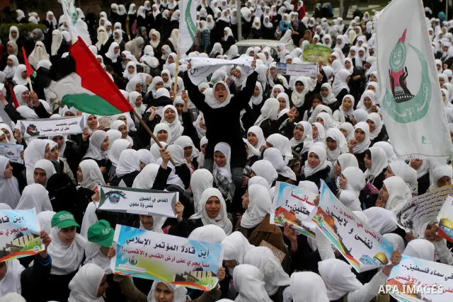 Palestinians female students shout slogans as she and others take part in a protest organized by the Islamic Hamas movement in Gaza city, on February 29, 2012, to show solidarity with Palestinians protesting last week at...