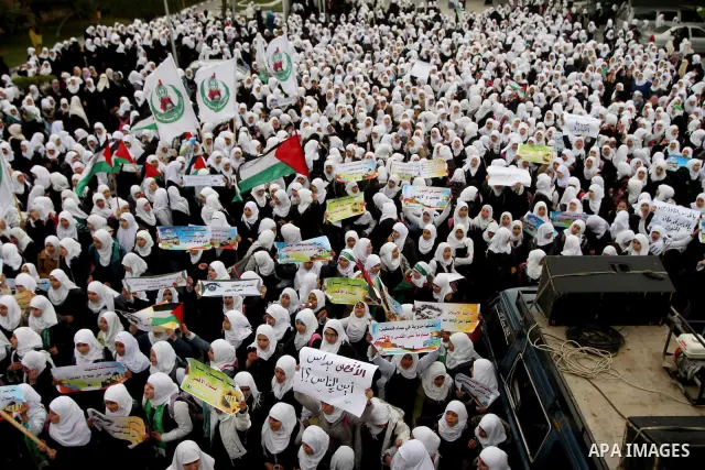 Palestinians female students shout slogans as she and others take part in a protest organized by the Islamic Hamas movement in Gaza city, on February 29, 2012, to show solidarity with Palestinians protesting last week at...
