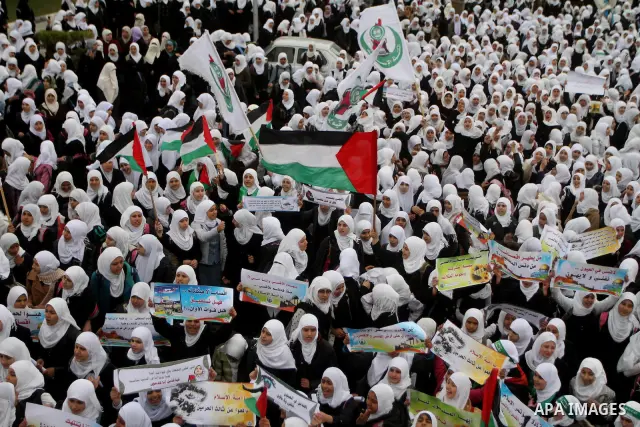 Palestinians female students shout slogans as she and others take part in a protest organized by the Islamic Hamas movement in Gaza city, on February 29, 2012, to show solidarity with Palestinians protesting last week at...