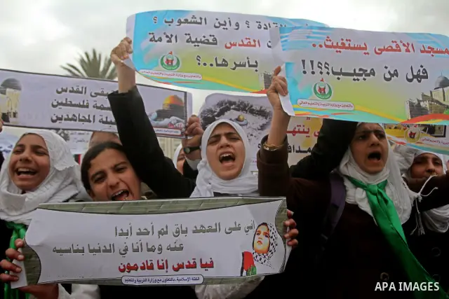 Palestinians female students shout slogans as she and others take part in a protest organized by the Islamic Hamas movement in Gaza city, on February 29, 2012, to show solidarity with Palestinians protesting last week at...