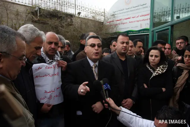 Staff members of a local private television station "Watan",during press conference speaks for the damage caused after Israeli troops raided this and another Palestinian television station in the West Bank city of Ramall...