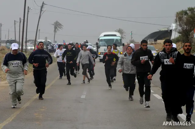Participants compete in the UN-sponsored Gaza marathon in Gaza City on March 1, 2012. Thousands of runners braved temperatures hovering just above zero degrees centigrade to take part in the impoverished Palestinian terr...