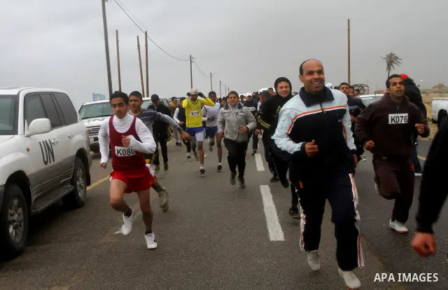 Participants compete in the UN-sponsored Gaza marathon in Gaza City on March 1, 2012. Thousands of runners braved temperatures hovering just above zero degrees centigrade to take part in the impoverished Palestinian terr...