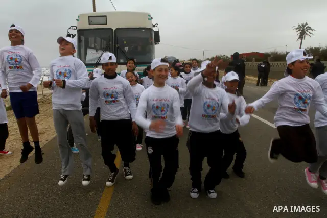 Participants compete in the UN-sponsored Gaza marathon in Gaza City on March 1, 2012. Thousands of runners braved temperatures hovering just above zero degrees centigrade to take part in the impoverished Palestinian terr...