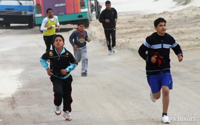 Participants compete in the UN-sponsored Gaza marathon in Gaza City on March 1, 2012. Thousands of runners braved temperatures hovering just above zero degrees centigrade to take part in the impoverished Palestinian terr...