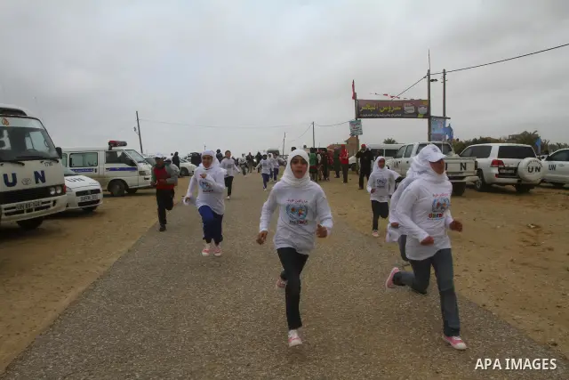 Participants compete in the UN-sponsored Gaza marathon in Gaza City on March 1, 2012. Thousands of runners braved temperatures hovering just above zero degrees centigrade to take part in the impoverished Palestinian terr...