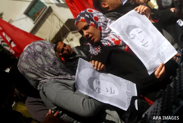 Palestinians demonstrate in solidarity with Hana'a Shalabi during a protest in Gaza City, on mar. 05, 2012. Shalabi, released by Israel in a prisoner swap last year but re-arrested earlier this month and held without cha...