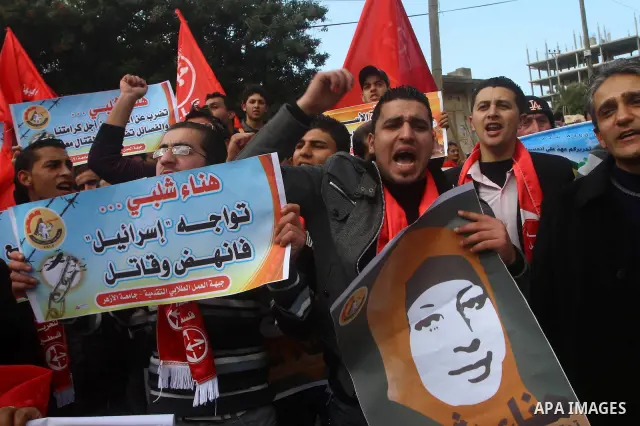 Palestinians demonstrate in solidarity with Hana'a Shalabi during a protest in Gaza City, on mar. 05, 2012. Shalabi, released by Israel in a prisoner swap last year but re-arrested earlier this month and held without cha...