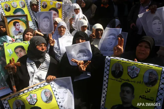Palestinians demonstrate in solidarity with Hana'a Shalabi during a protest in Gaza City, on mar. 05, 2012. Shalabi, released by Israel in a prisoner swap last year but re-arrested earlier this month and held without cha...