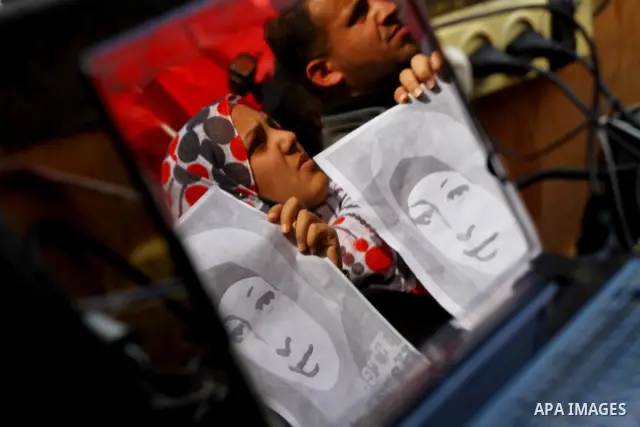 Palestinians demonstrate in solidarity with Hana'a Shalabi during a protest in Gaza City, on mar. 05, 2012. Shalabi, released by Israel in a prisoner swap last year but re-arrested earlier this month and held without cha...