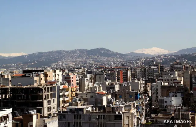 Snow covers Beirut mountains (background) in Lebanon, after a heavy snowstorm, March 5, 2012. Photo by Mohammed Asad