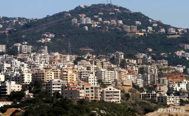 Snow covers Beirut mountains (background) in Lebanon, after a heavy snowstorm, March 5, 2012. Photo by Mohammed Asad