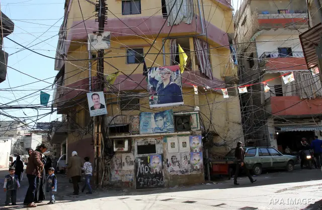 Palestinians walk in alley in one of the most poor regions at Burj al-Barajneh Palestinian refugee camp in Beirut, in Lebanon, March 5, 2012. About 25,000 person live in this poor refugee camp who face hard and difficult...