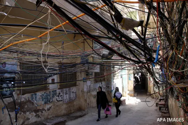 Palestinians walk in alley in one of the most poor regions at Burj al-Barajneh Palestinian refugee camp in Beirut, in Lebanon, March 5, 2012. About 25,000 person live in this poor refugee camp who face hard and difficult...