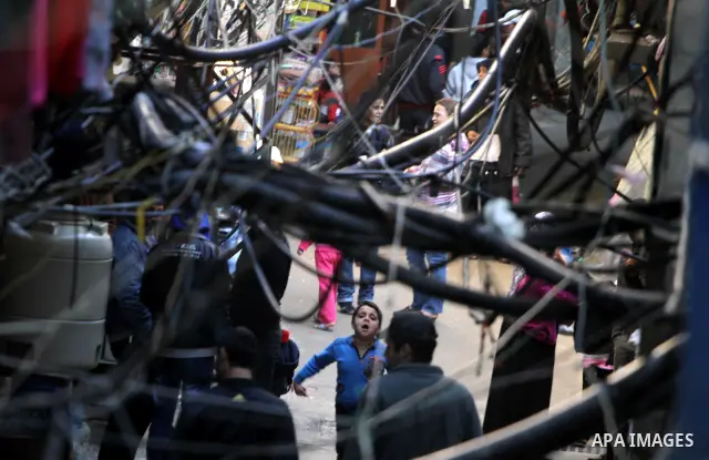 Palestinians walk in alley in one of the most poor regions at Sabra and Shatila Palestinian refugee camp in Beirut, in Lebanon, March 5, 2012. About 11,000 person live in this poor refugee camp who face hard and difficul...